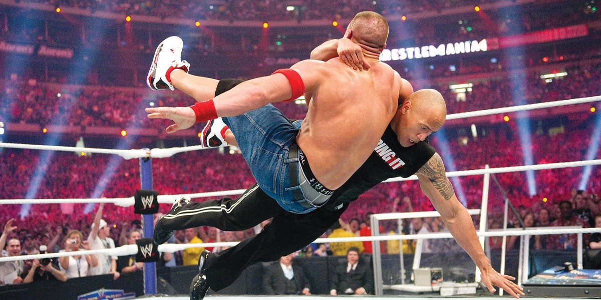 Dwayne Johnson tackling John Cena at WrestleMania 27