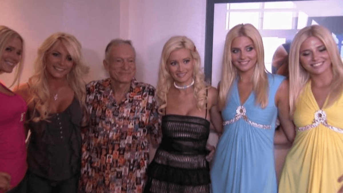Hugh Hefner with the Playboy girls in The Girls Next Door