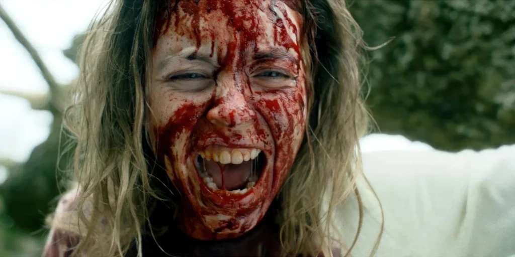 Sydney Sweeney's face covered in blood in Immaculate