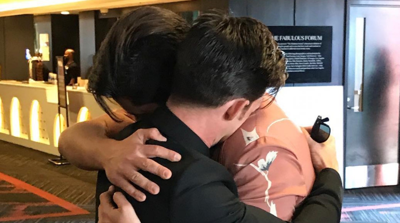 Drake Bell and Josh Peck hugging 