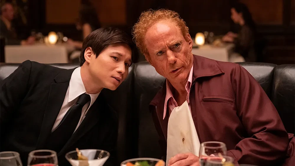 Robert Downey Jr. and Hoa Xuande in the steakhouse scene in The Sympathizer