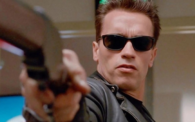Arnold Schwarzenegger with a shotgun