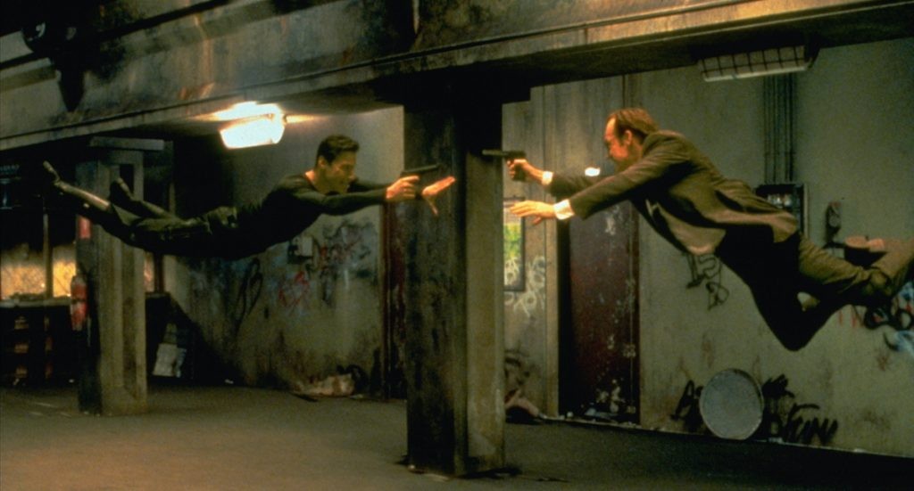 Keanu Reeves and Hugo Weaving in the subway tunnel fight scene in The Matrix