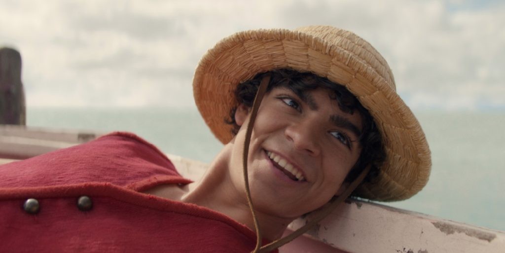Iñaki Godoy as Luffy on a sailing boat in a scene in One Piece