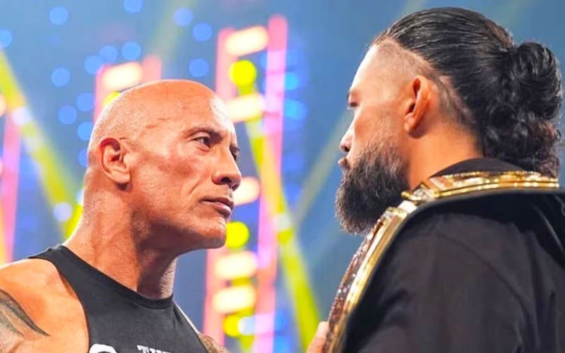 The Rock and Roman Reigns stare down each other 