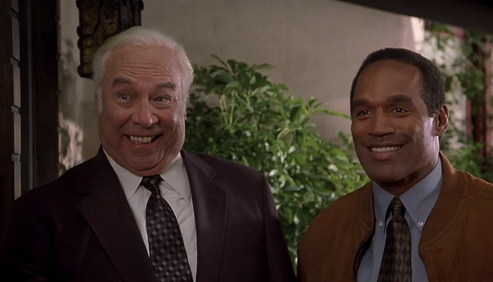 O.J. Simpson (right) in a still from Naked Gun 33 1/3: The Final Insult (1994)