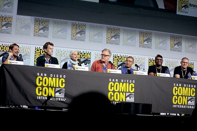 The team of the DCAU featuring Bruce Timm and Glen Murakami in the center | Credits: Wikimedia Commons 