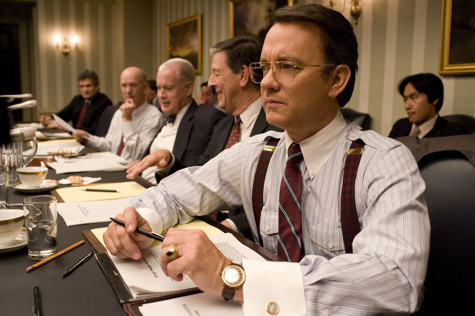 Tom Hanks as Congressman Charlie Wilson in a boardroom meeting in Charlie Wilson's War