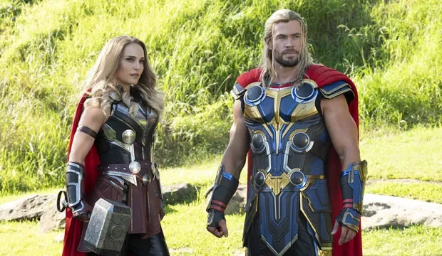 Chris Hemsworth and Natalie Portman stand next together in their supersuits in Thor: Love and Thunder