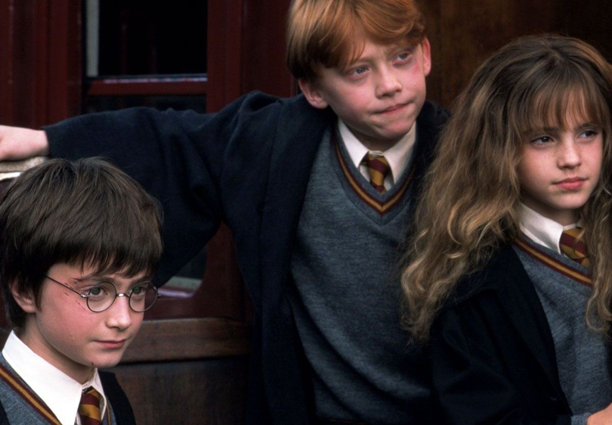 Harry, Ron, and Hermione on the Hogwarts Express