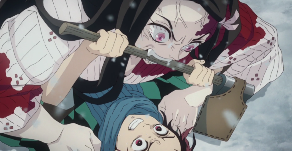 Nezuko Kamado attacking Tanjiro Kamado after turning in a demon for the first time
