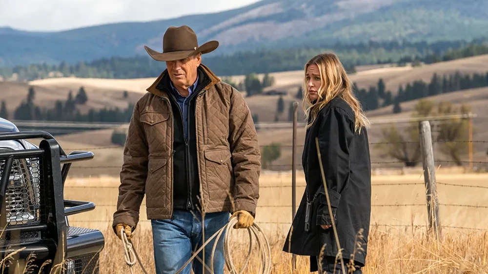 Kevin Costner as John Dutton walks along a field in Yellowstone