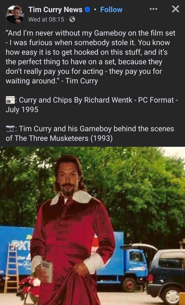 Tim Curry and his favorite gaming handheld.