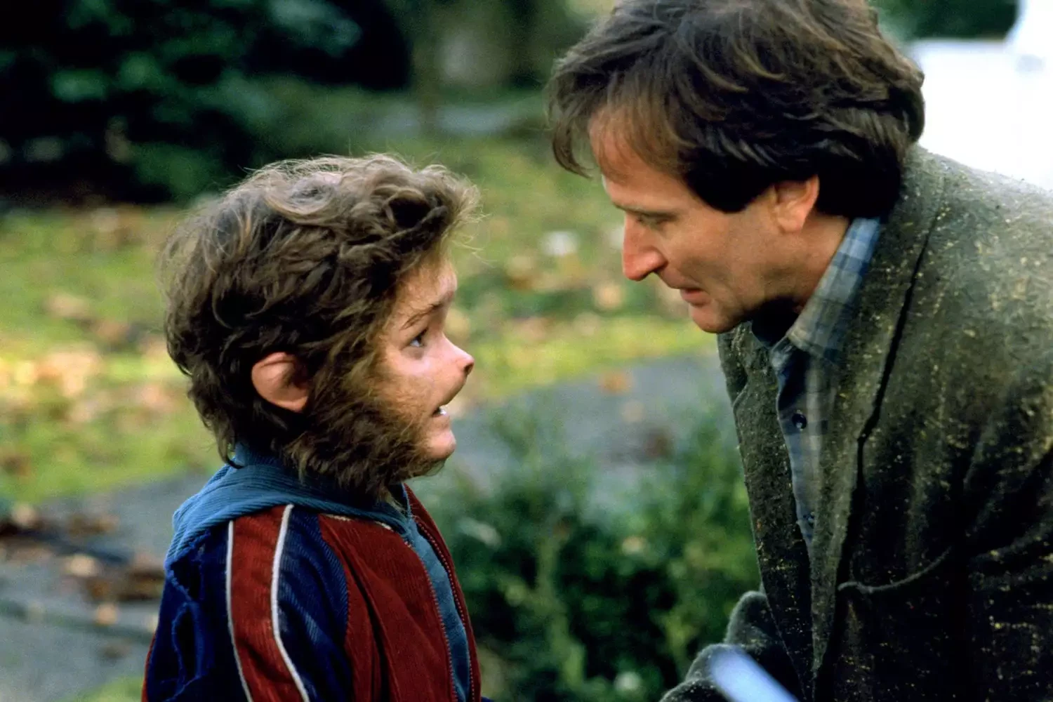 Bradley Pierce and Robin Williams in Jumanji (1995) | Credit: Columbia Pictures