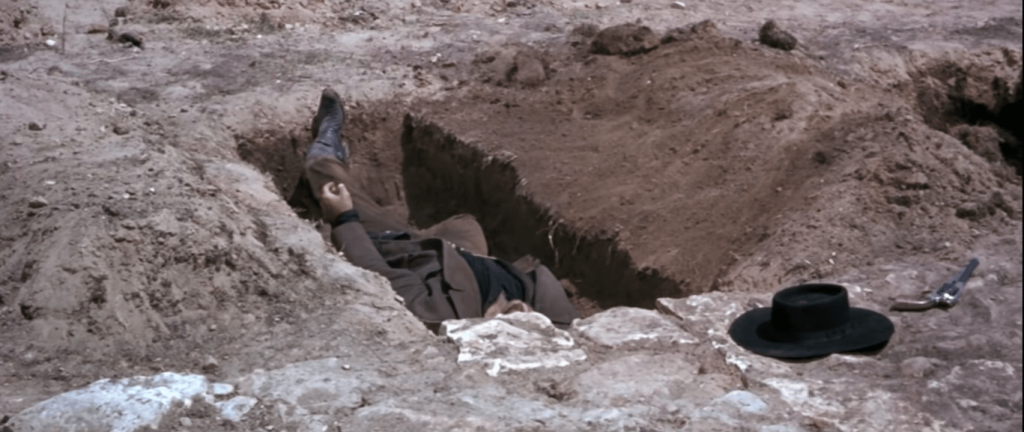 Angel Eyes' death scene in a still from the third film of the Dollars Trilogy.