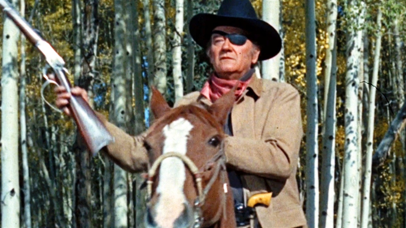 John Wayne as cowboy Reuben Cogburn in True Grit