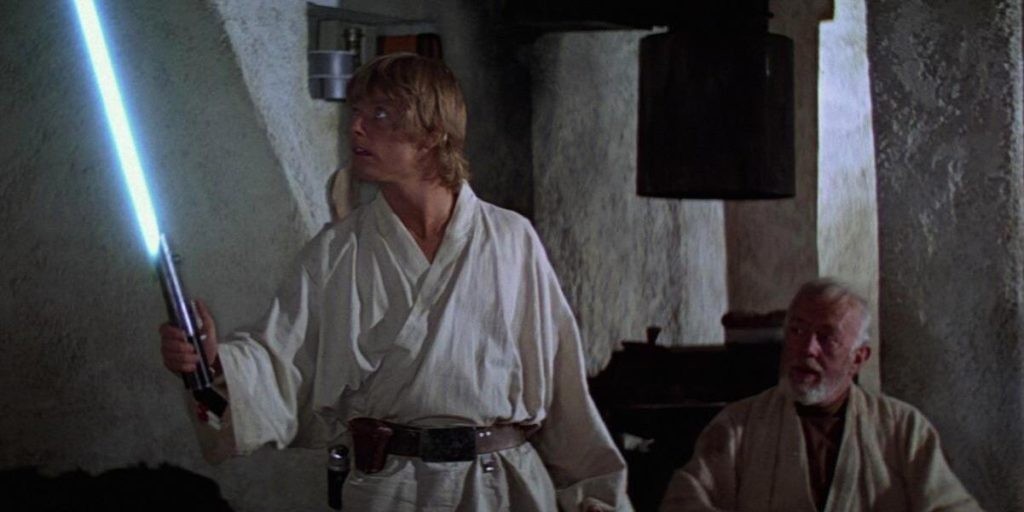 Luke Skywalker holding the Lightsaber in Star Wars 