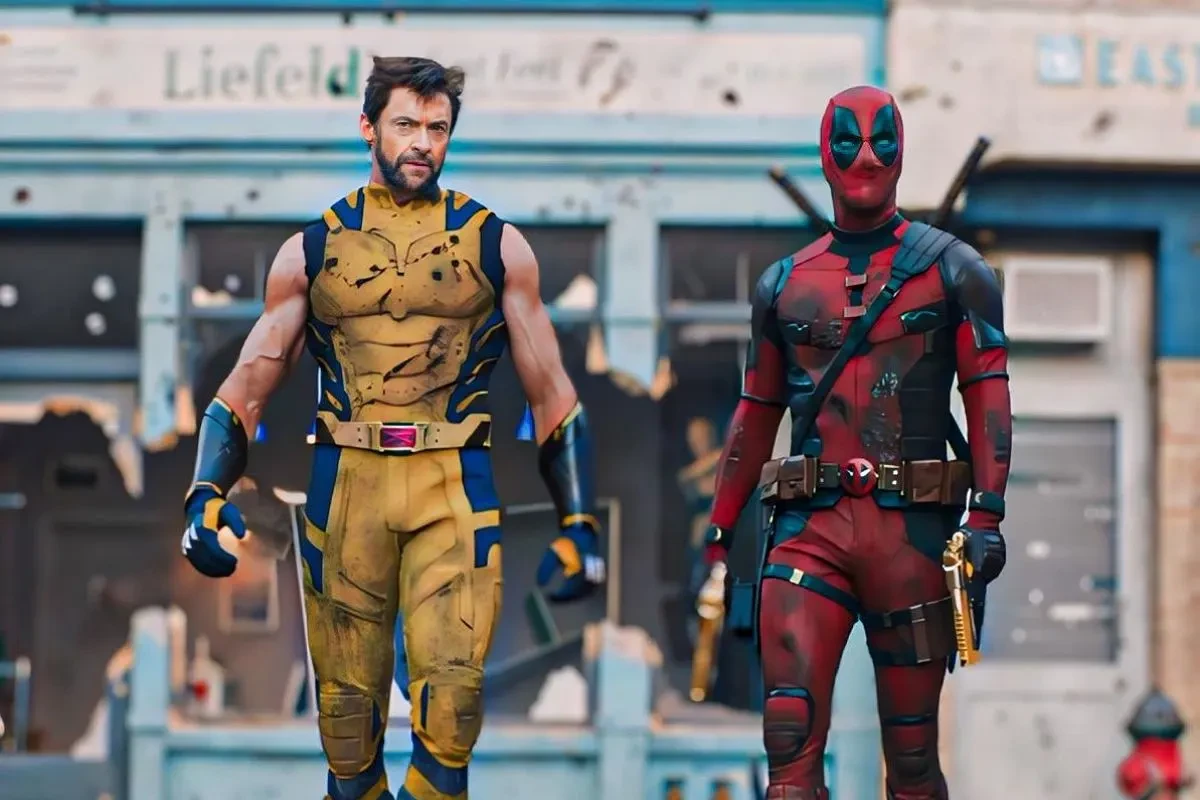 Hugh Jackman and Ryan Reynolds walk to battle in a still from Deadpool & Wolverine