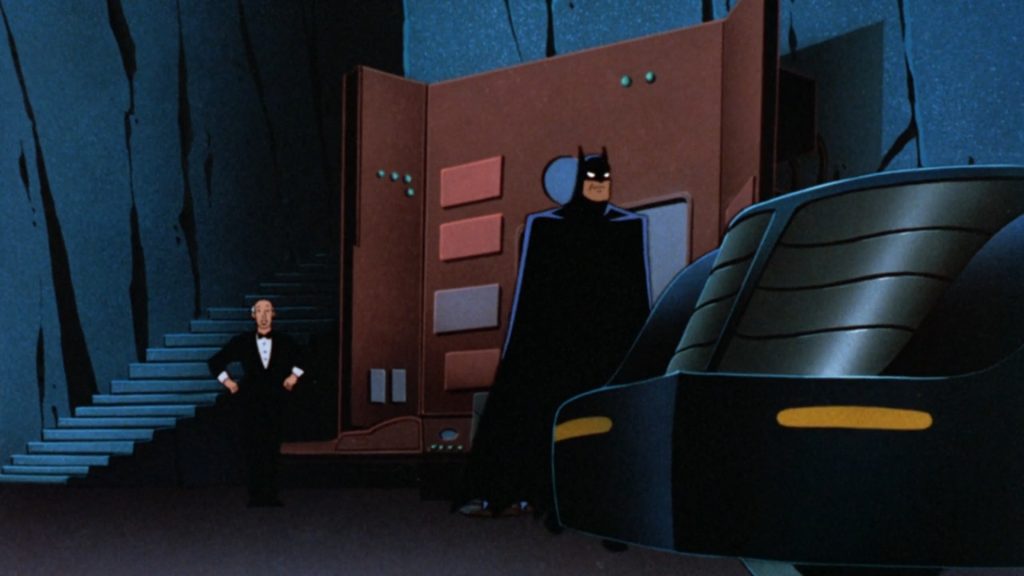 Batman standing by the Batmobile while Alfred watches from behind in Batman: Mask of the Phantasm