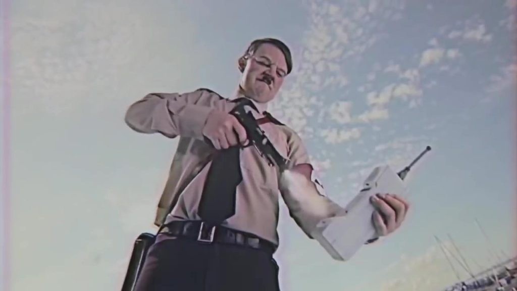 Jorma Taccone as Adolf Hitler shooting his communication device