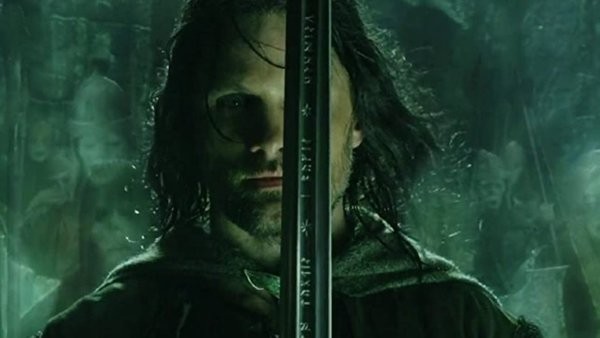 Viggo Mortensen holds the sword of Andúril in The Lord of the Rings: The Return of the King