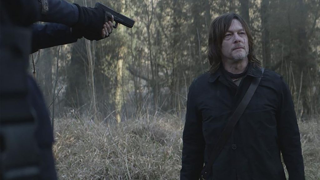 Norman Reedus as Daryl Dixon at a gunpoint