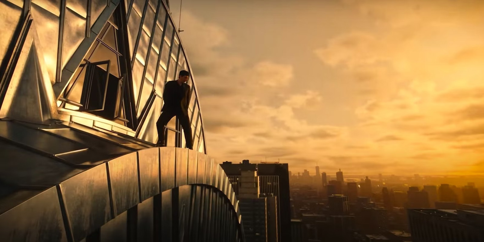 Adam Driver stands atop a skyscraper in a still from Francis Ford Coppola's Megalopolis