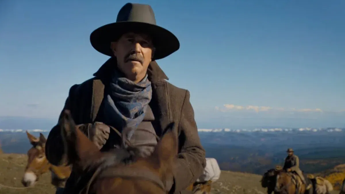 Kevin Costner rides across a vast landscape in a still from Horizon: An American Saga