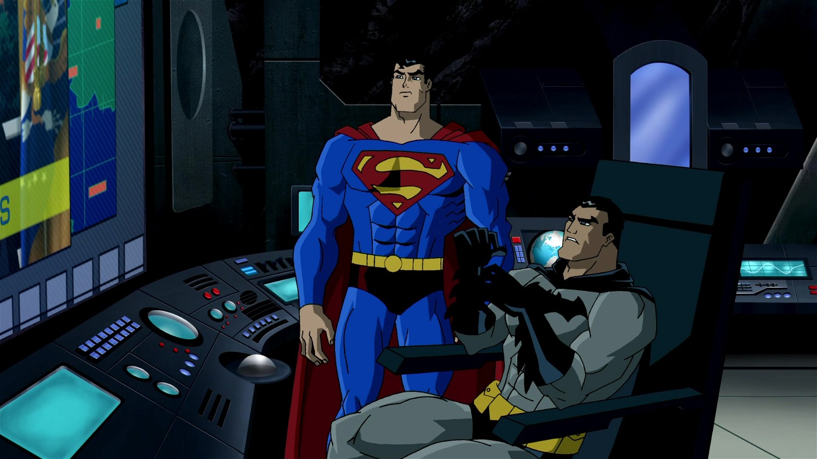 Superman and Batman investigate in the Batcave in a scene from Superman/Batman: Public Enemies