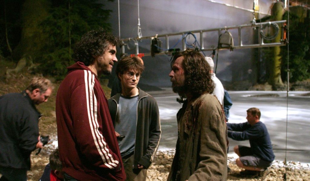 Gary Oldman, Alfonso Cuarón, and Daniel Radcliffe in Harry Potter and the Prisoner of Azkaban