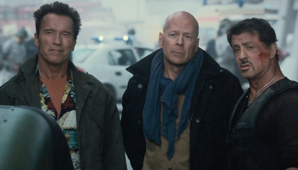 Arnold Schwarzenegger, Bruce Willis, and Sylvester Stallone in The Expendables 2. | Credit: Lionsgate.