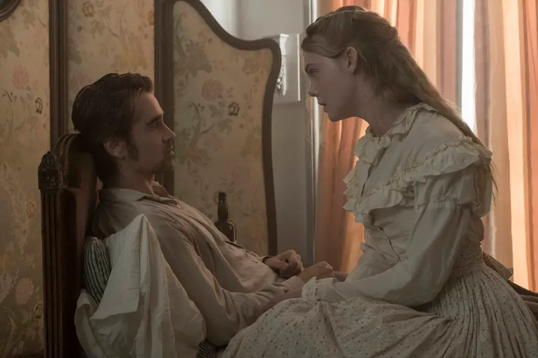 Colin Farrell and Elle Fanning share an intimate moment in The Beguiled