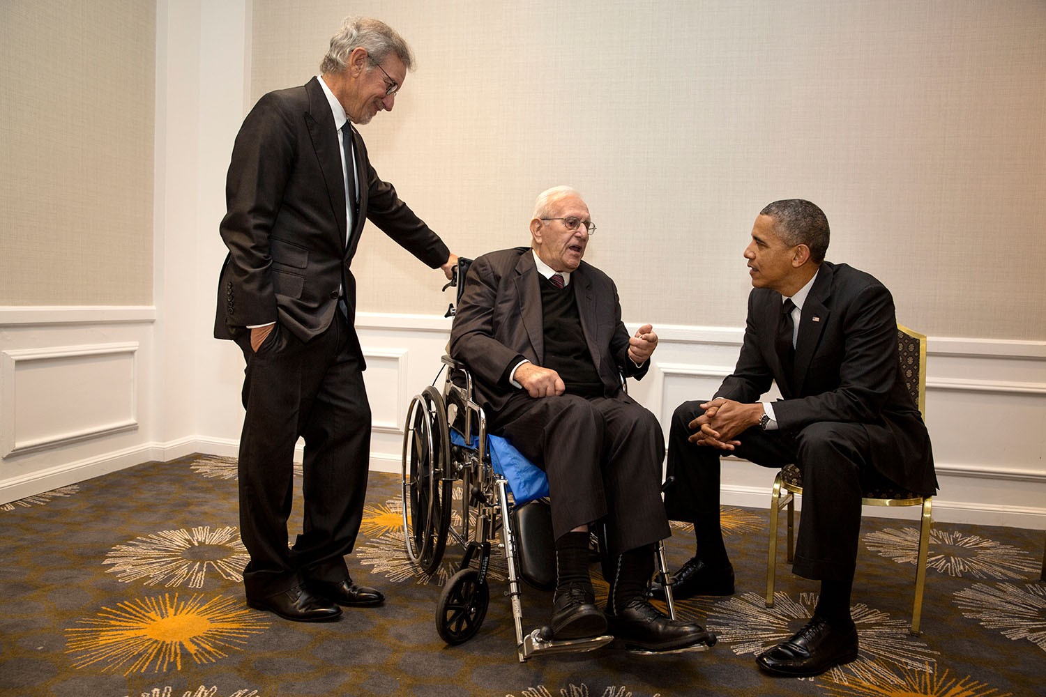 President Barack Obama visits with Steven Spielberg and his father Arnold Spielberg in Los Angeles (Official White House Photo by Pete Souza | Wikimedia Commons)