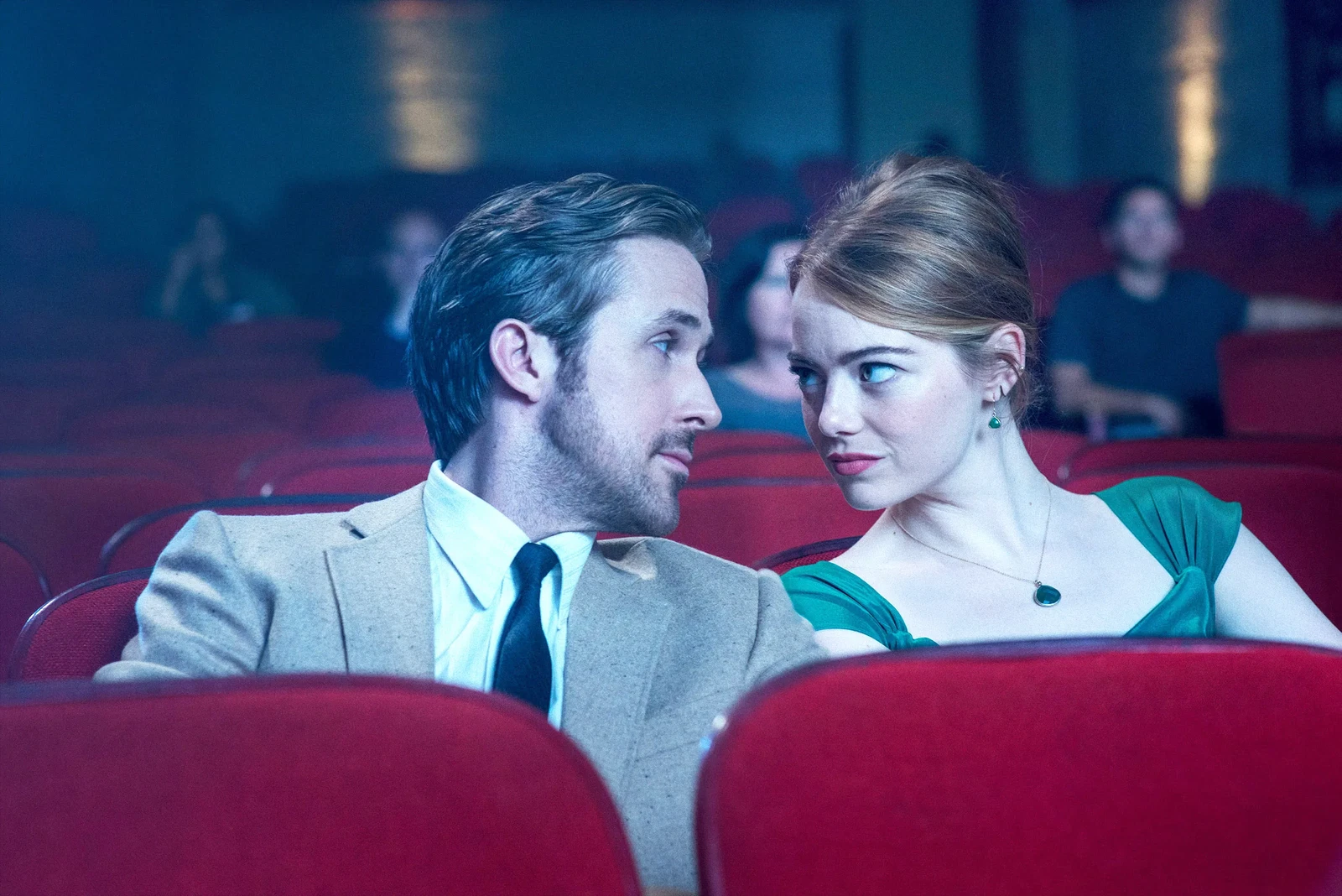 Ryan Gosling and Emma Stone share a moment inside a theater in La La Land