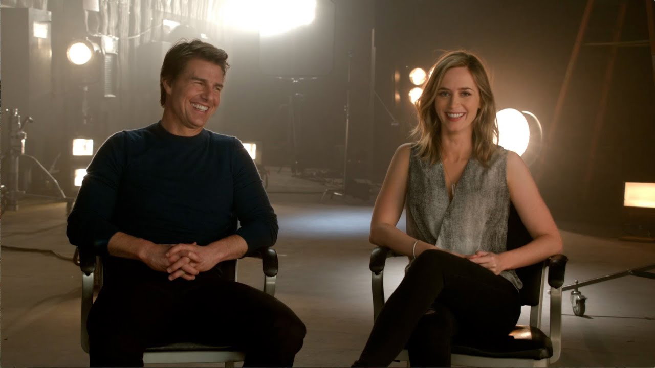 Emily Blunt and Tom Cruise smile for the camera in a WB Promotional on YouTube | Warner Bros. Pictures