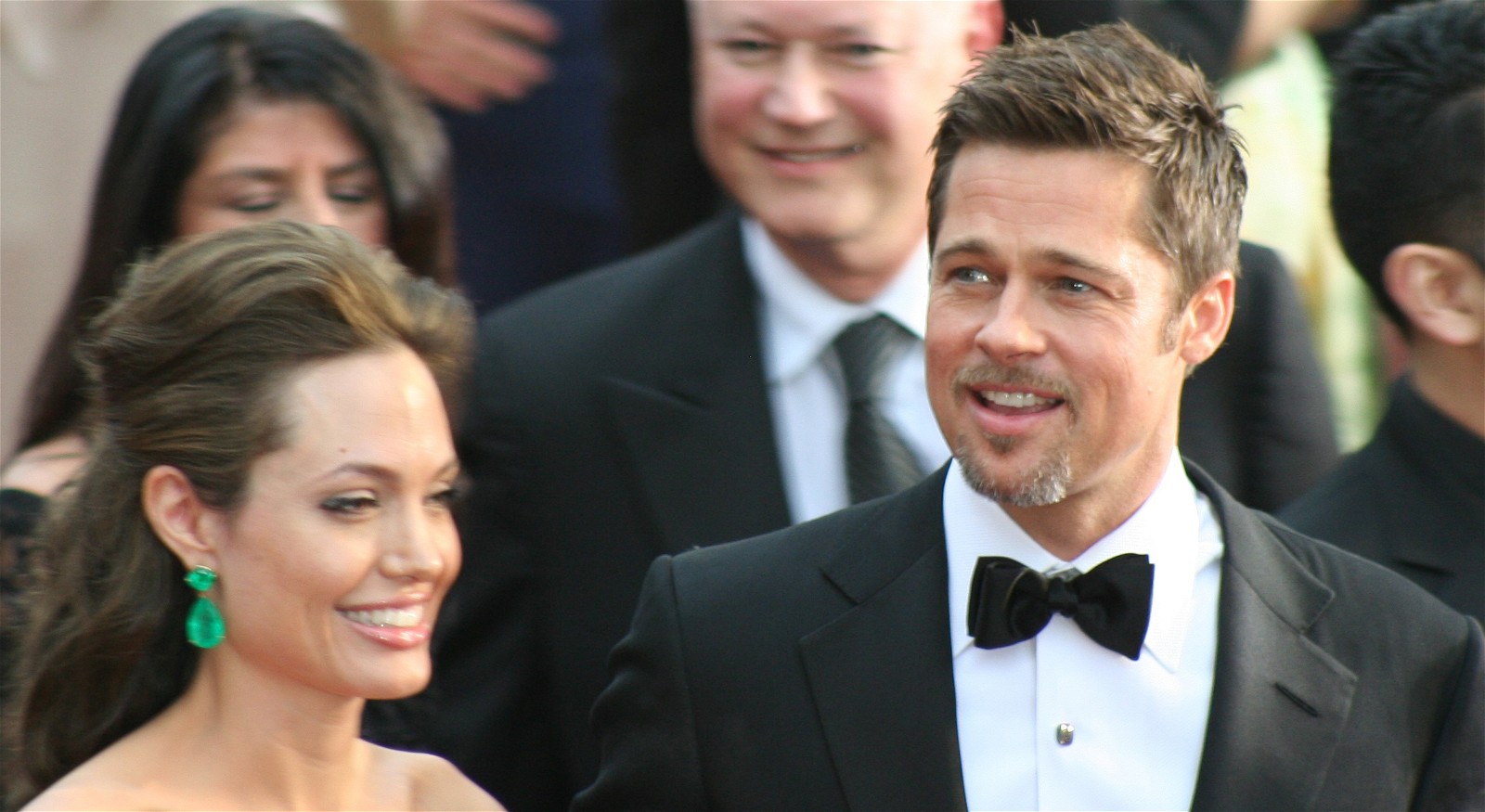Angelina Jolie and Brad Pitt smiling at the 81st Academy Awards