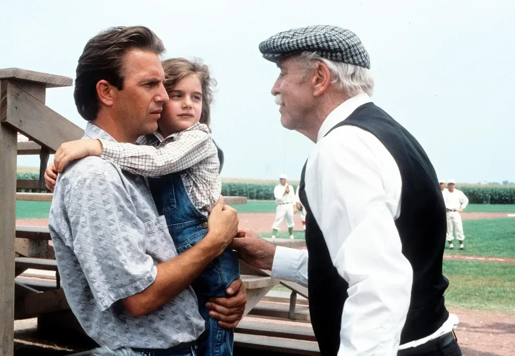 Costner and Hoffman in a still from Field of Dreams. | Credit: Universal Pictures.