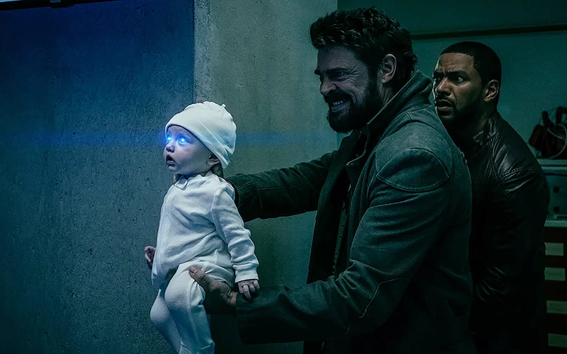 The Boys Season 5 Characters Sorted Into Hogwarts Houses 7 Karl Urban as Billy Butcher holding a baby in The Boys