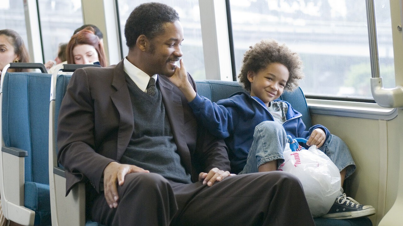 Will Smith and Jaden Smith smiling in a still from Pursuit of Happyness