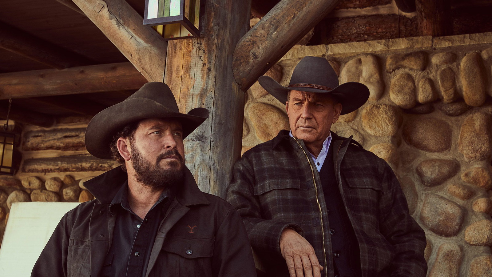 Screen-grab of a scene from Yellowstone featuring Kevin Costner with a grin