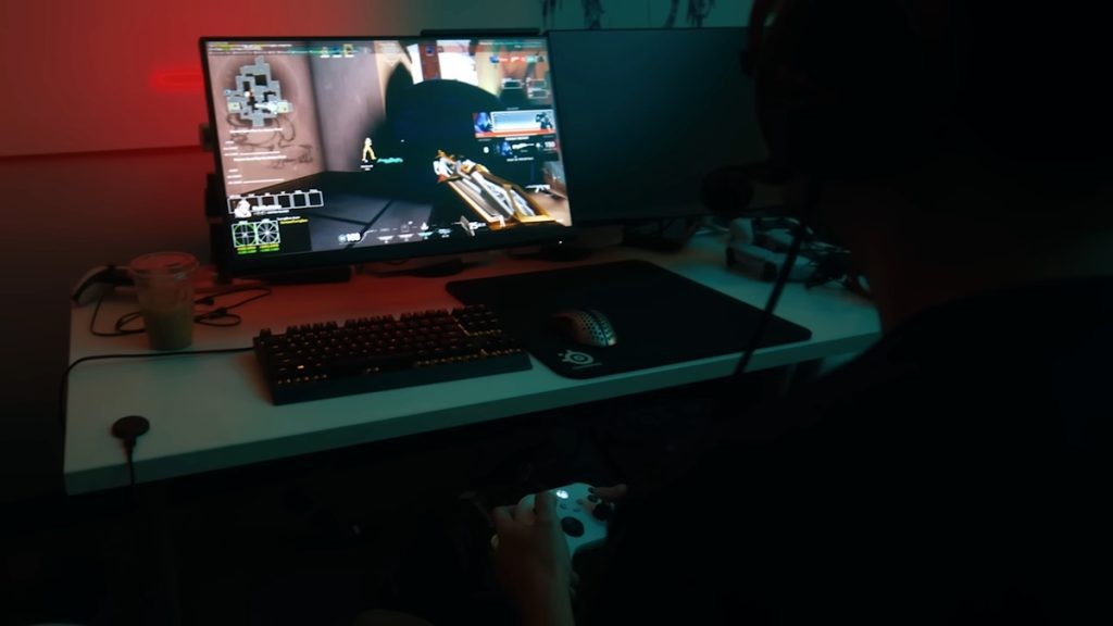 A scene from Riot's latest promotional video for Valorant console release, featuring a player trying out the game using an Xbox controller.