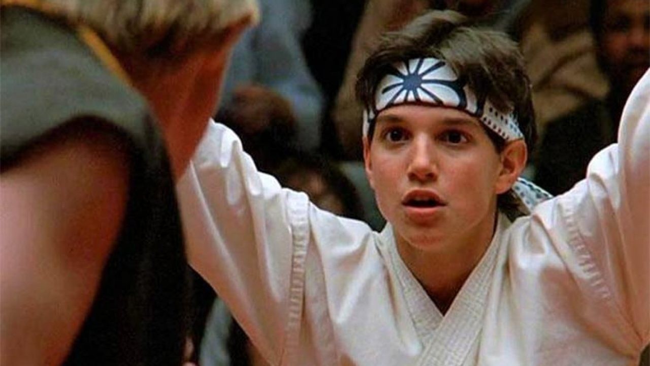 Ralph Macchio in the midst of a karate fight in a still from The Karate Kid