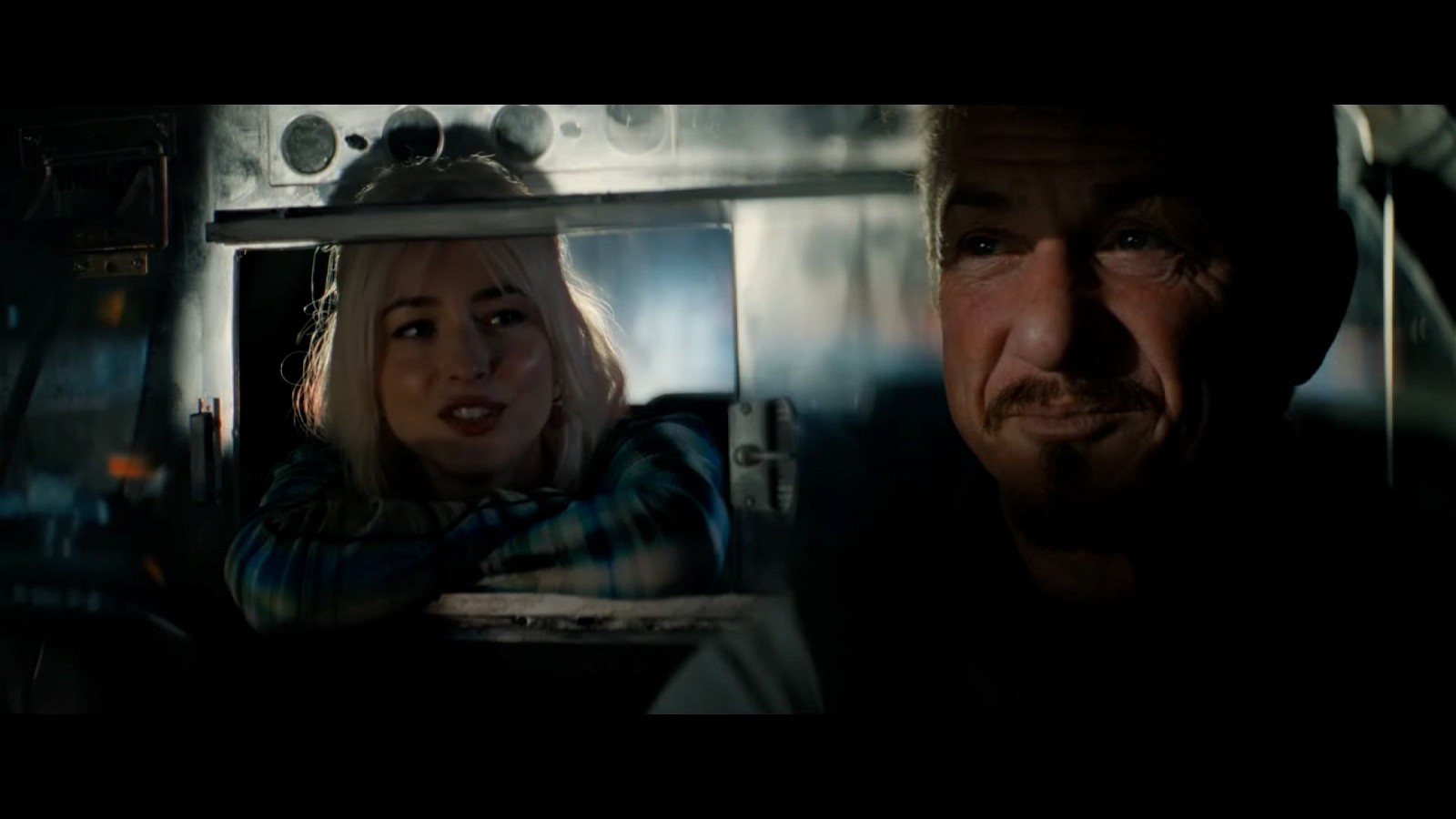 Dakota Johnson and Sean Penn interacting in a still from Daddio trailer
