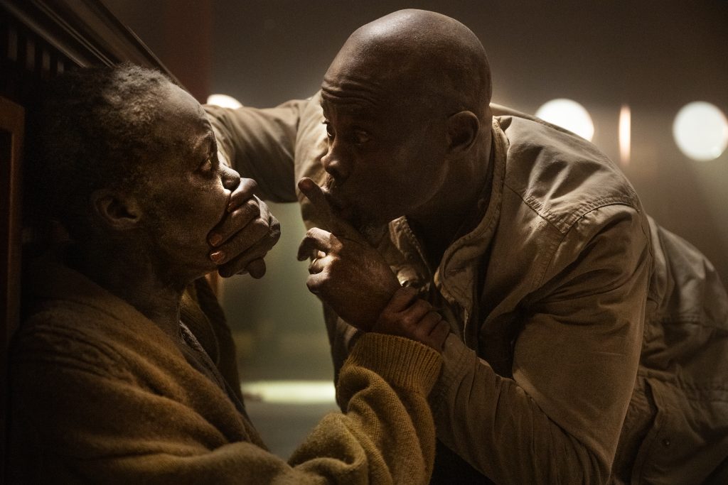 Lupita Nyong’o as “Samira” and Djimon Hounsou as “Henri”