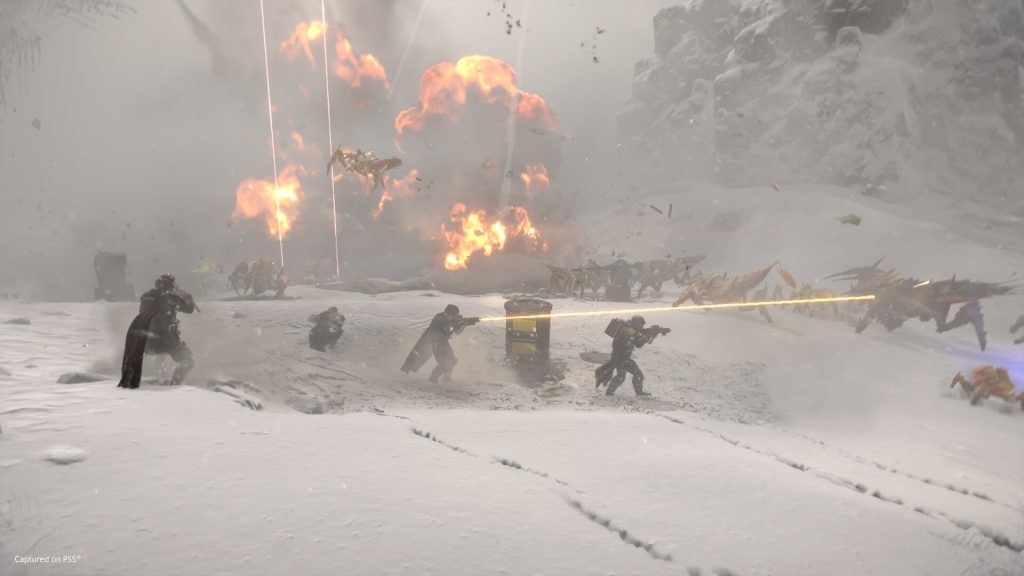 Helldivers fighting on a snowy planet against the Terminids.