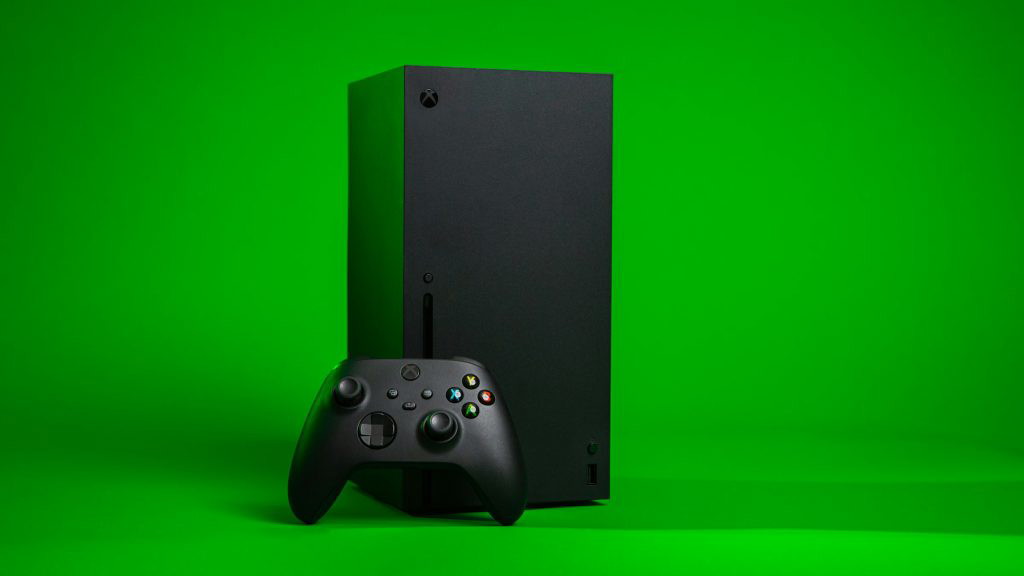 The Xbox Series X on a green background. 