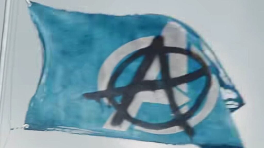 Avengers logo with Anarchy 'A' painted over it