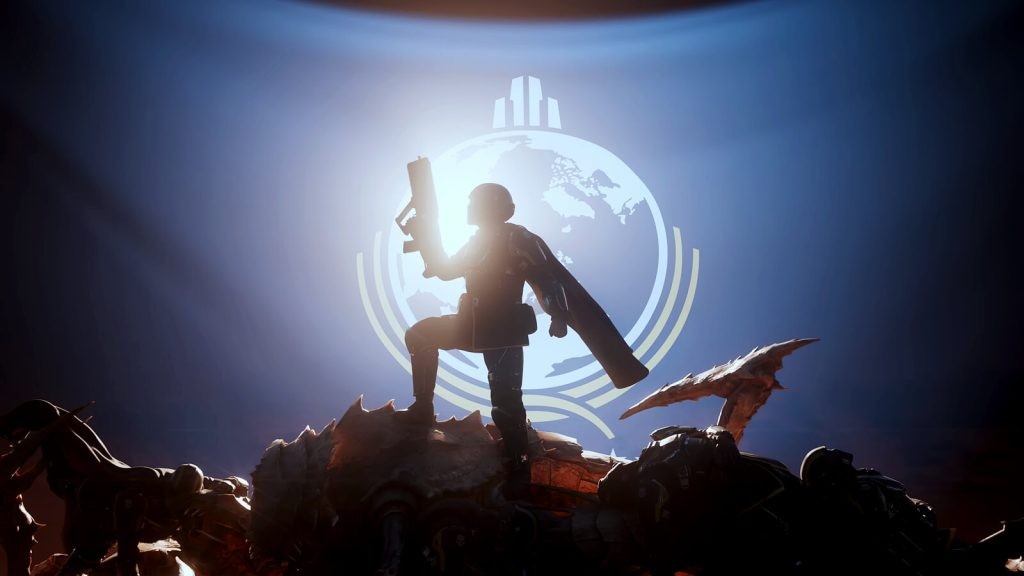 An image from Helldivers 2 shows a Super Earth soldier posing on top of a dead Terminid enemy, holding an assault rifle.