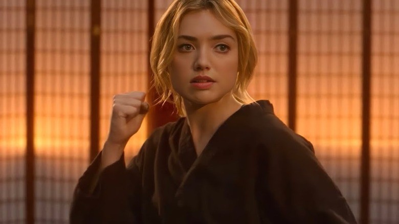Peyton List as Tory Nichols in a karate stance