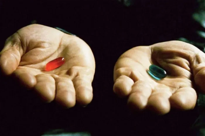 Morpheus shows the red pill and the blue pill
